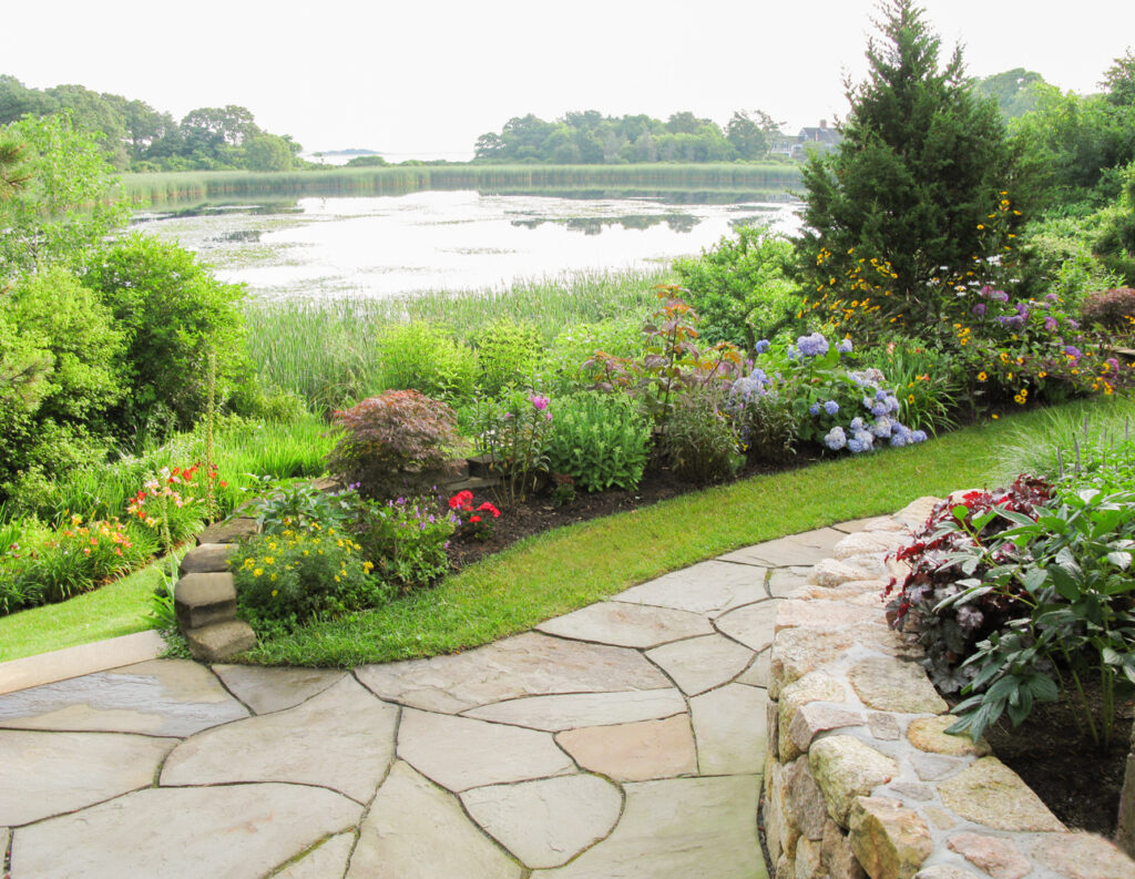 Flagstone path and native plantings along a wetland on Cape Cod
